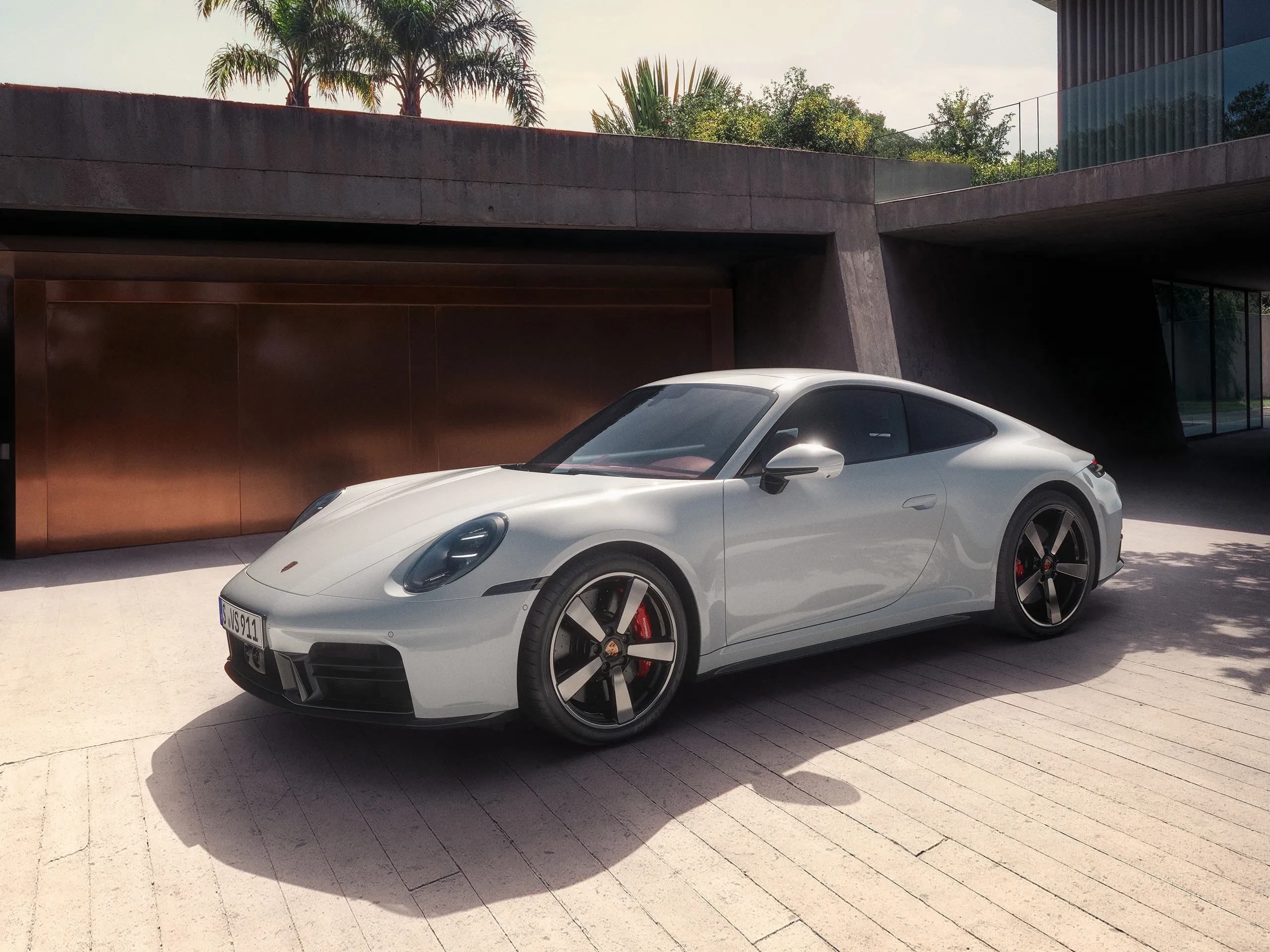 Side view of a Porsche 911 Carrera S in White.