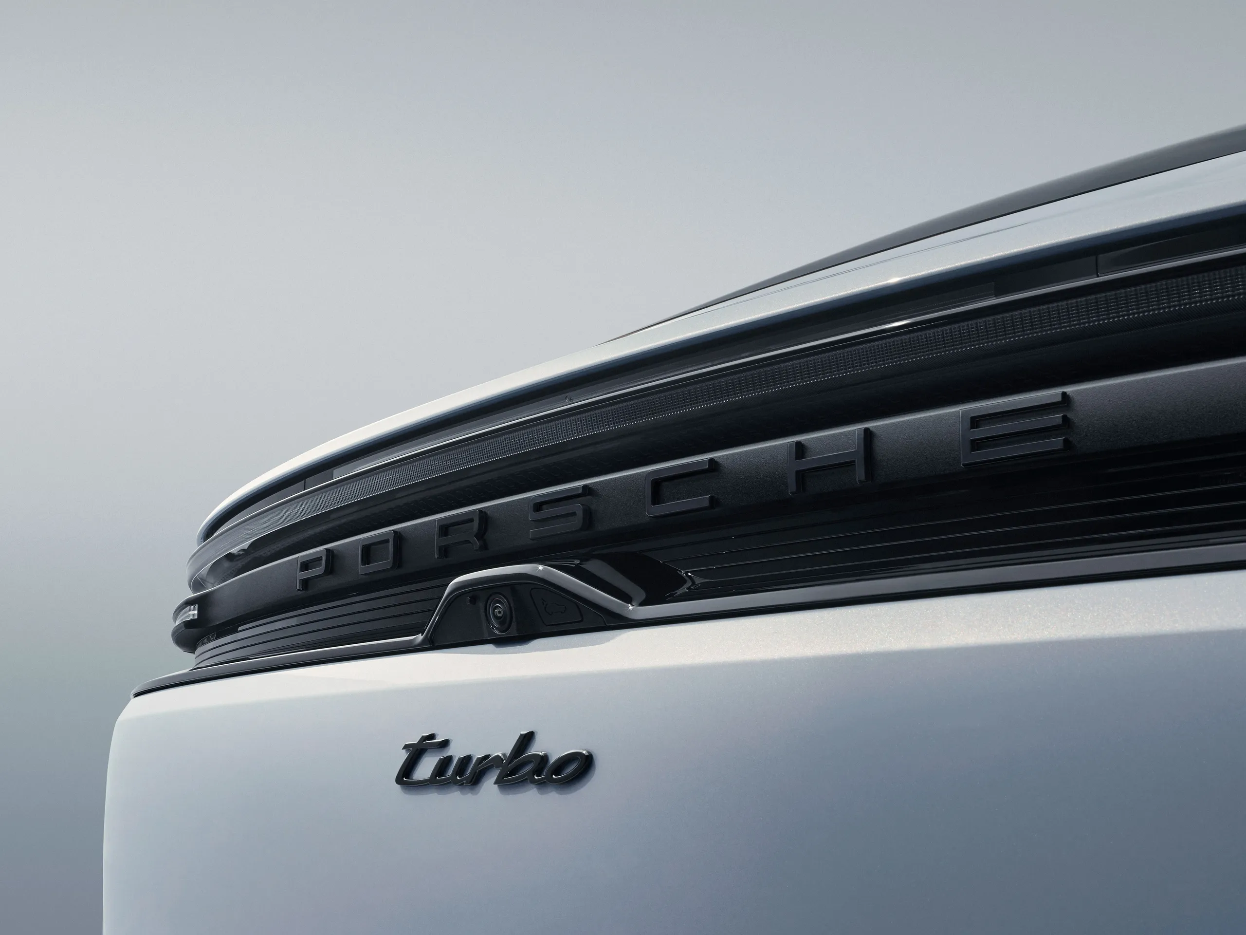 Close-up of the rear of a white Macan Turbo Electric.