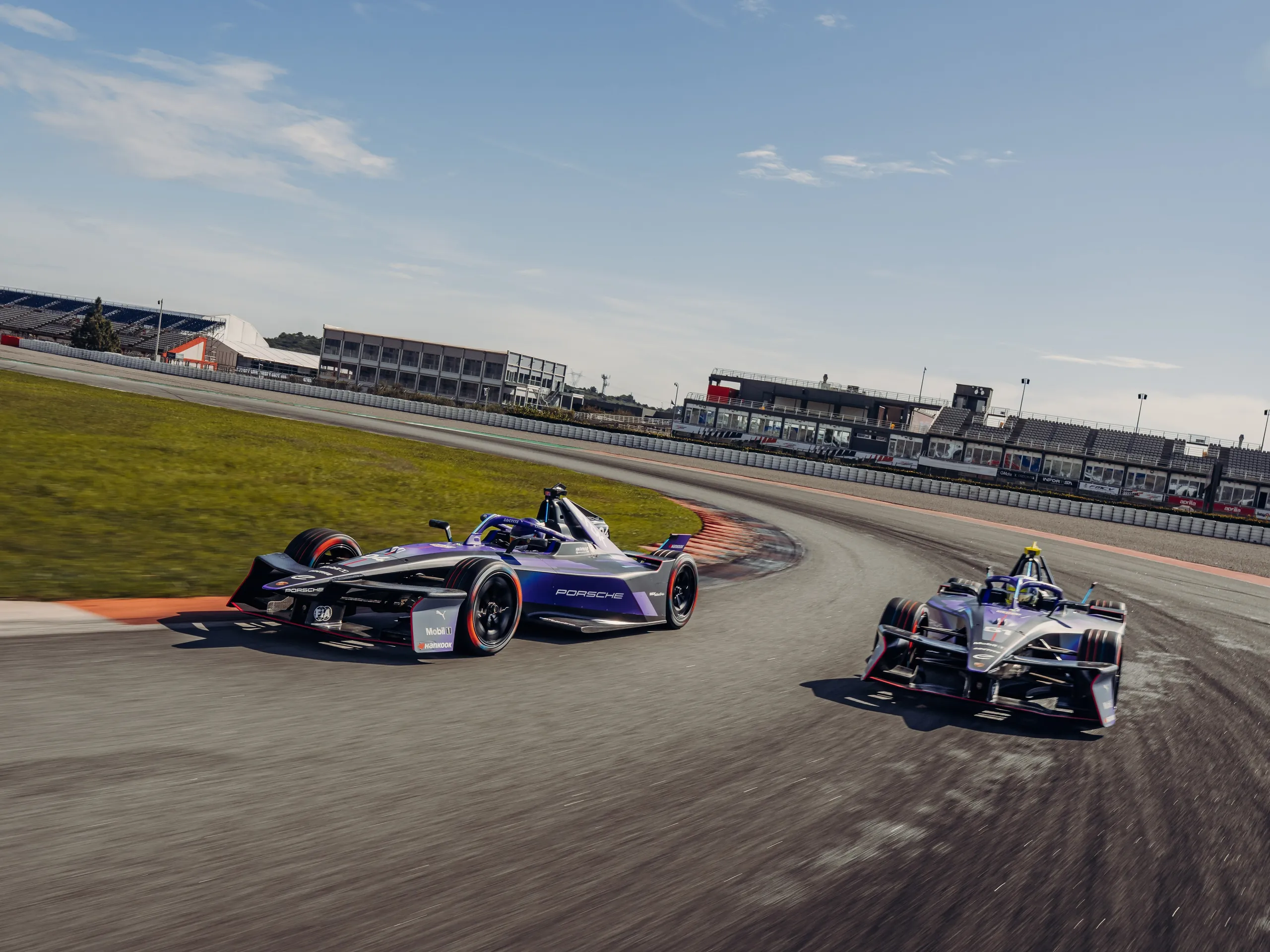 Both Porsche 99X cars side-by-side on track at Valencia.