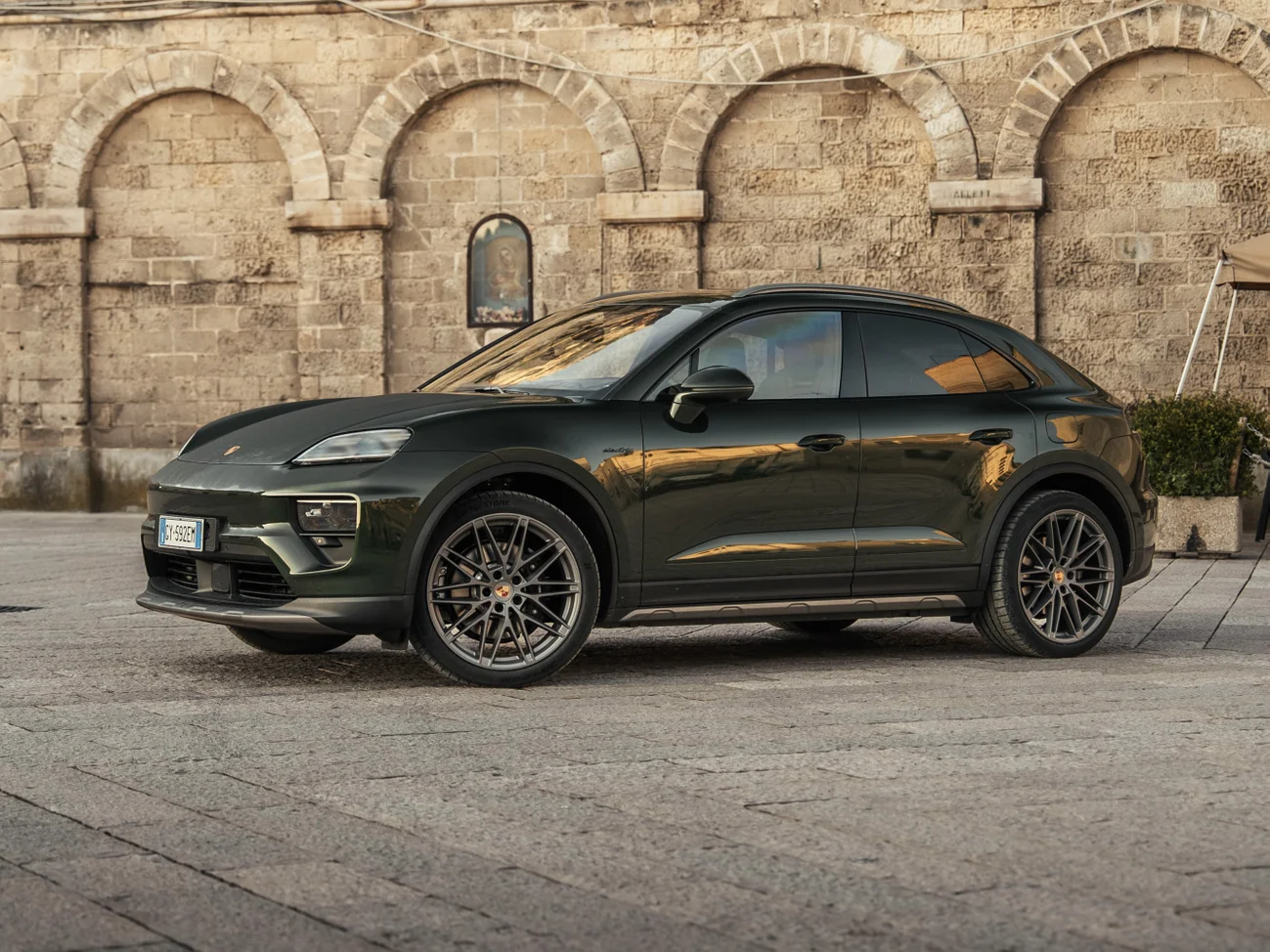 Porsche Macan 4S Electric in parked in Italian hillside village.