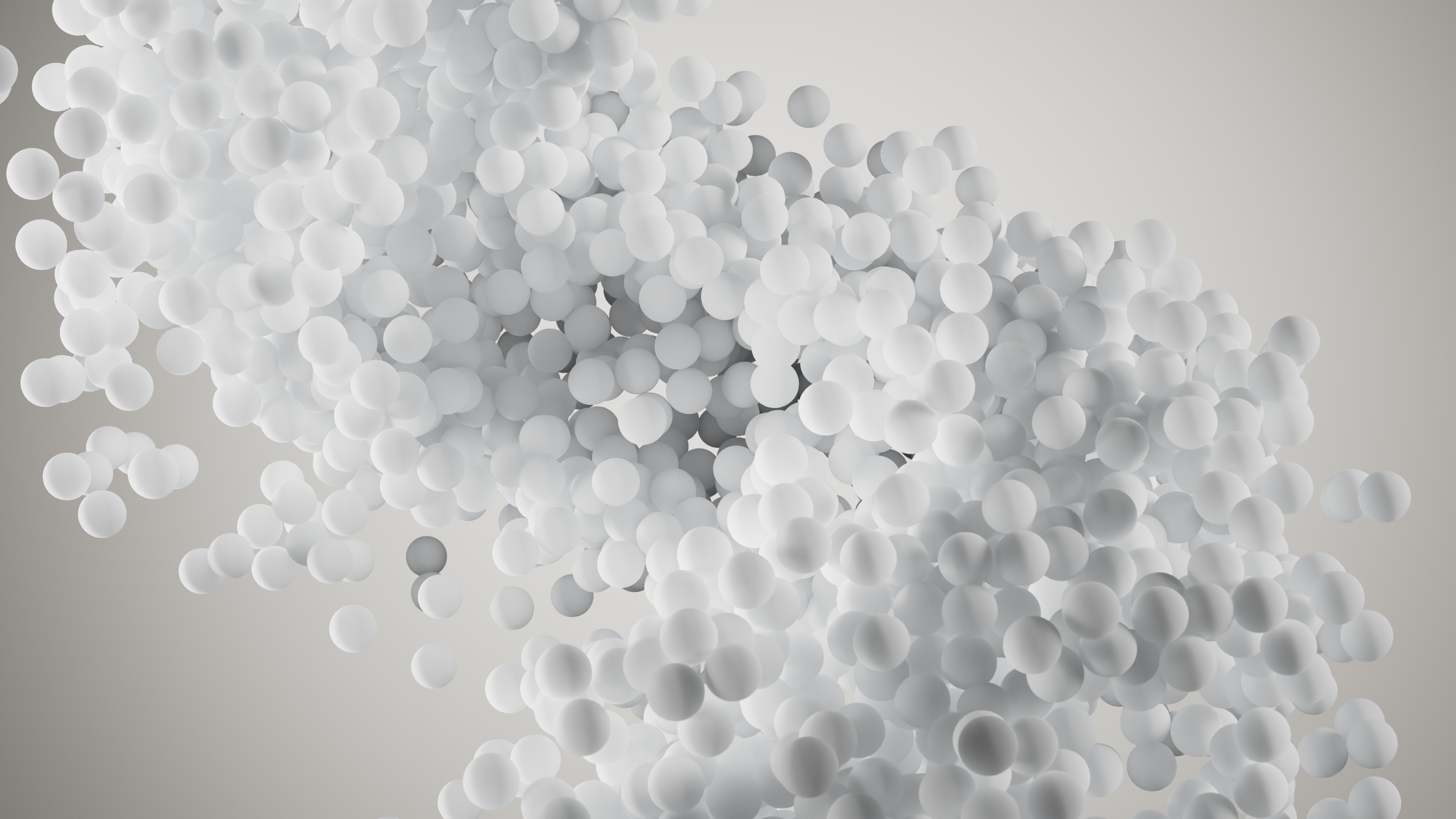 A dynamic cluster of white spheres floats against a neutral background, creating a sense of movement and depth.