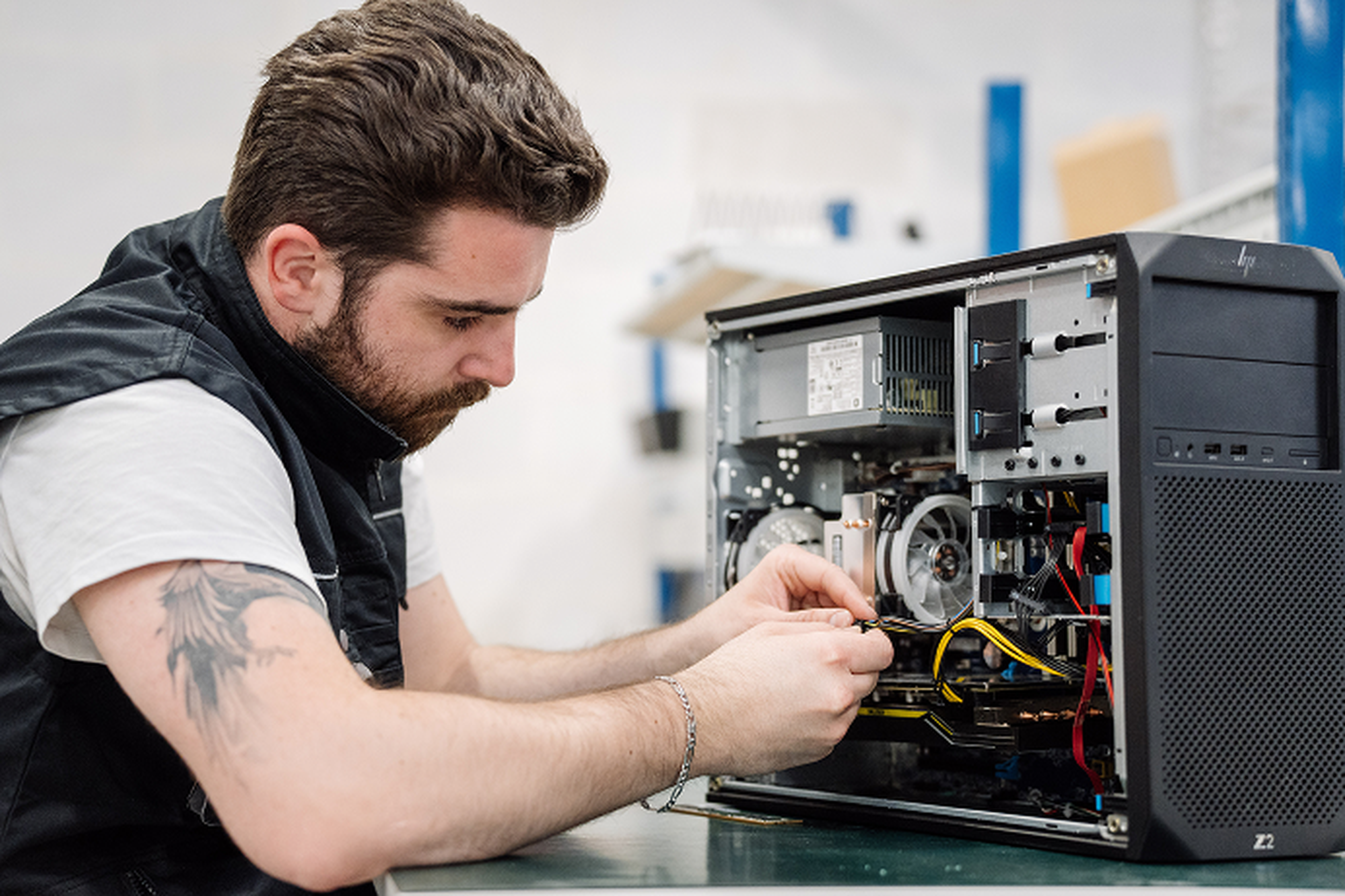AltEco engineer repairing or assembling a desktop computer