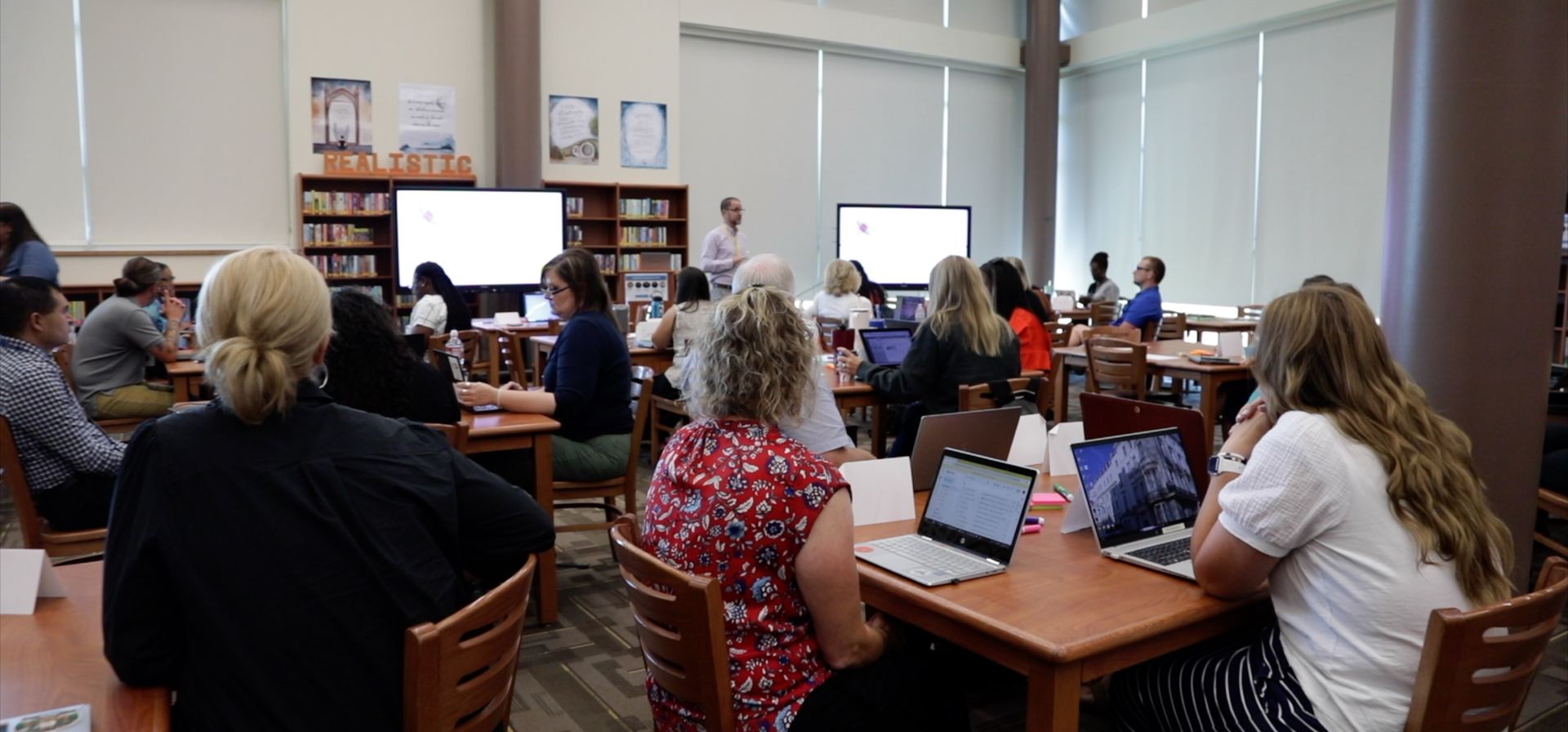 teachers-sitting-at-tables-with-their-laptops-open-during-a-training-in-Fort-Worth-Texas