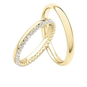 Trauringe Gelbgold mit Diamanten aussenrum