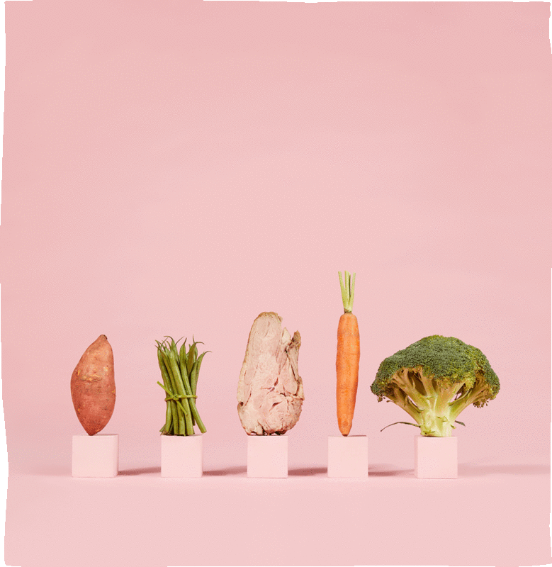 Vegetables dancing left and right with a pink background