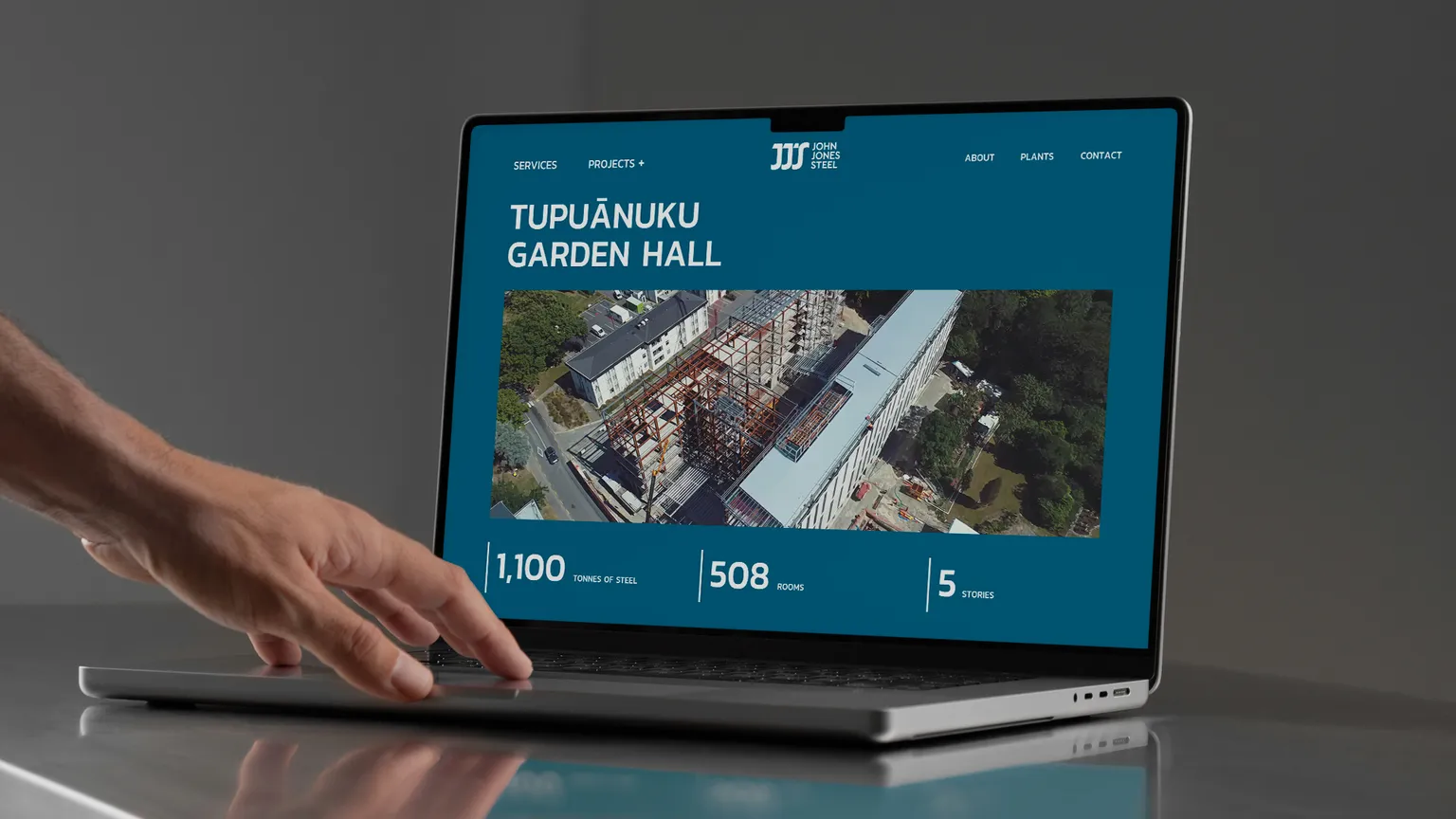 John Jones Steel project banner on laptop