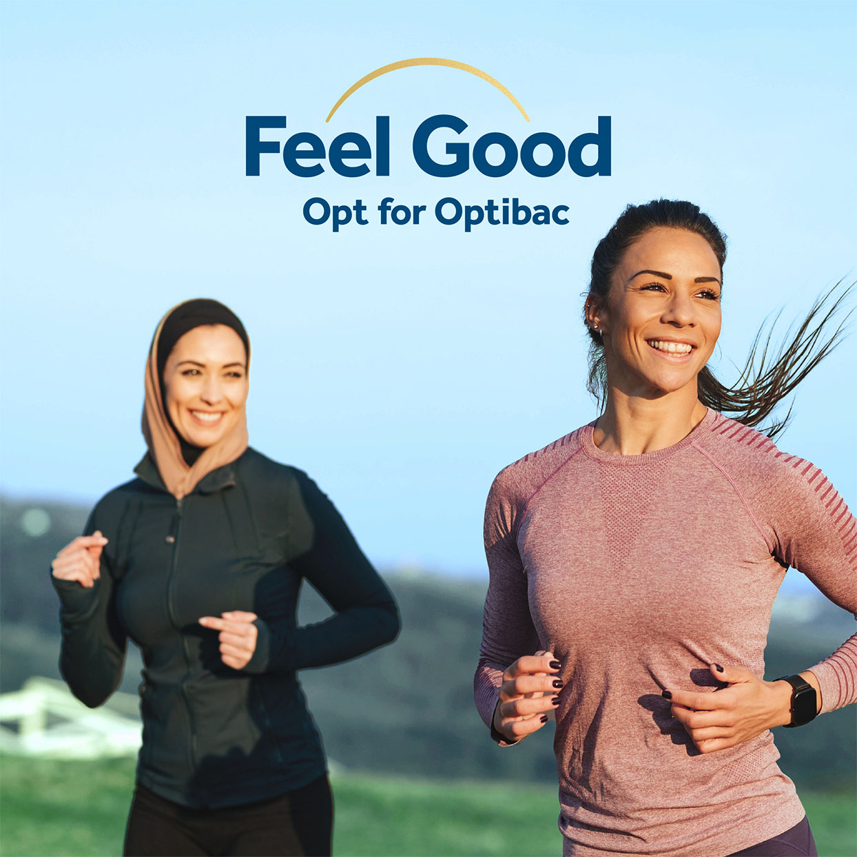 Two women jogging outdoors with smiles, one wearing a hijab. Text: "Feel Good, Opt for Optibac" at the top.