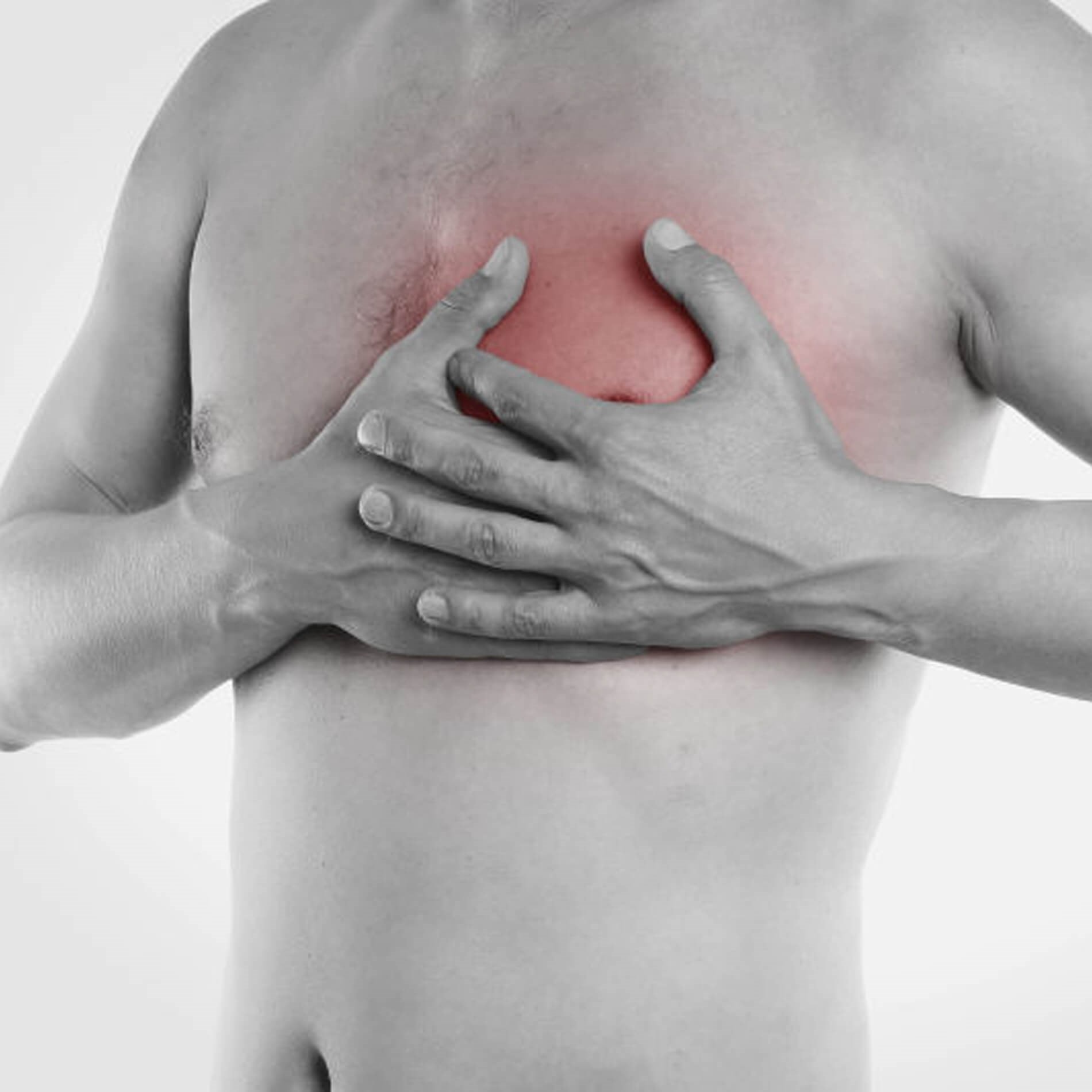 Person clutching their chest with both hands, showing a red area indicating pain or discomfort on the left side.