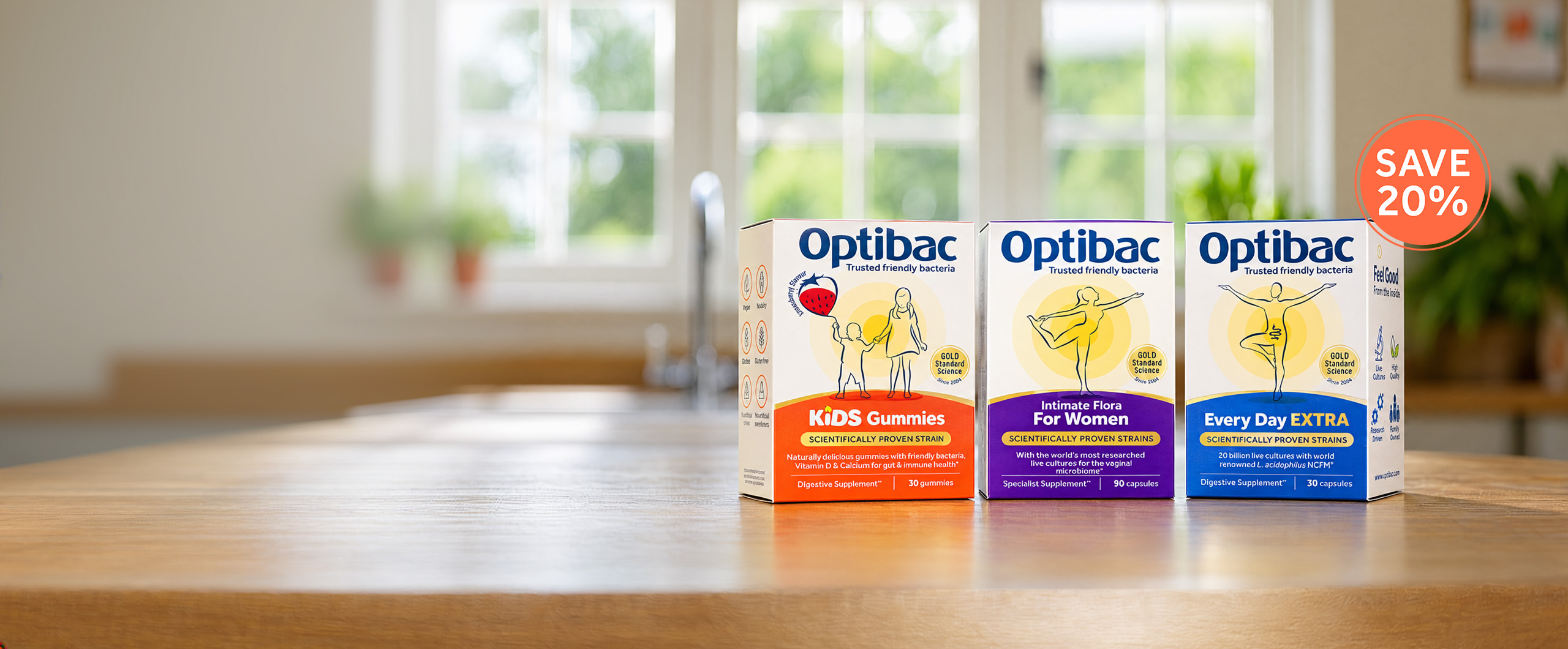 Three boxes of Optibac probiotic supplements for kids, women, and daily use on a wooden table with a "Save 20%" sticker.