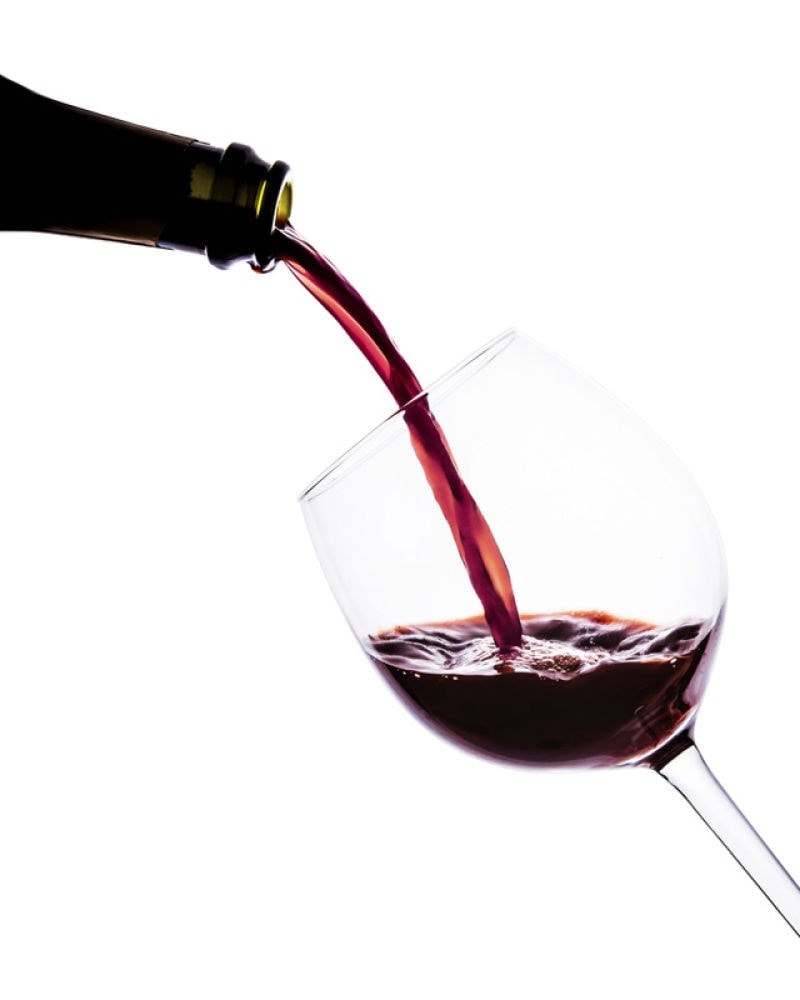 glass of wine being poured