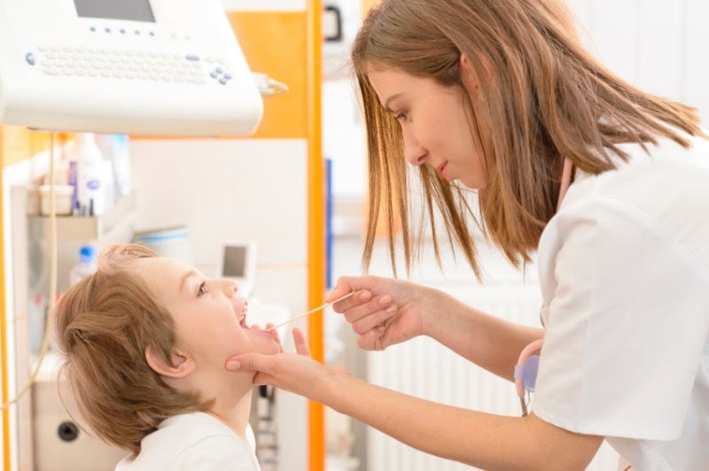 doctor examining child patient 