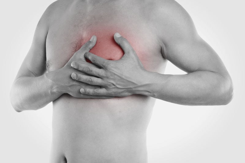 man holding his chest