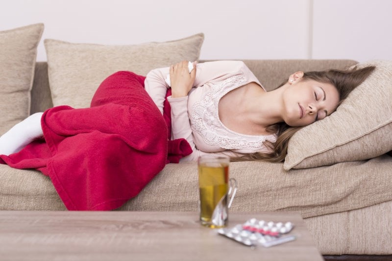 woman in pain with antibiotic side effects