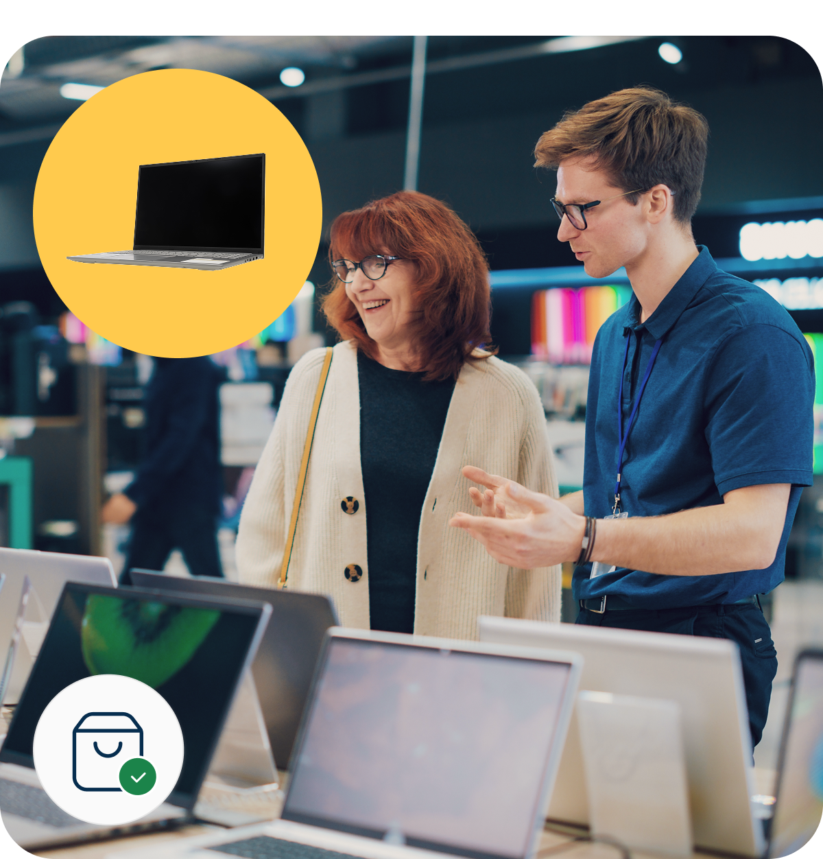 A store employee assists a woman shopping for laptops. A yellow circle with a laptop icon and a shopping bag icon overlay the image.