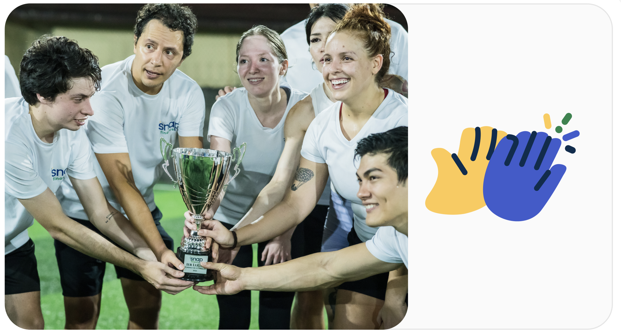 A group of athletes in white shirts celebrate, holding a trophy together, with a graphic of clapping hands to the right.