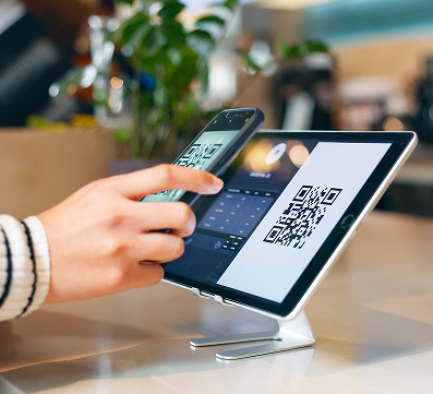 Retail store associate processing a customer payment using a modern POS system