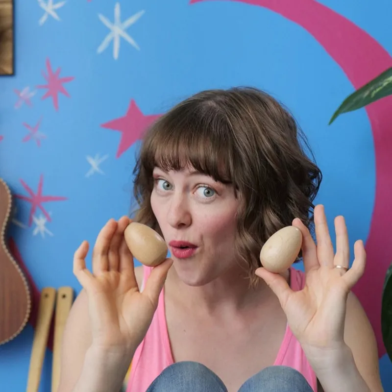 Teacher Brittany with shakers in her hands
