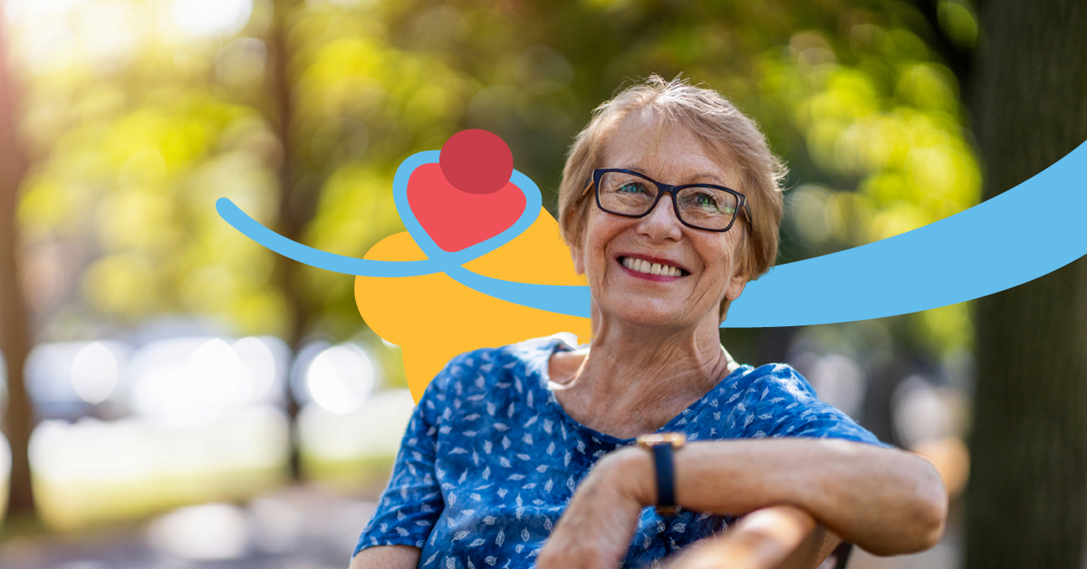 Smiling woman with glasses sitting on a bench in a park, wearing a blue patterned shirt. Abstract shapes and trees are in the background.