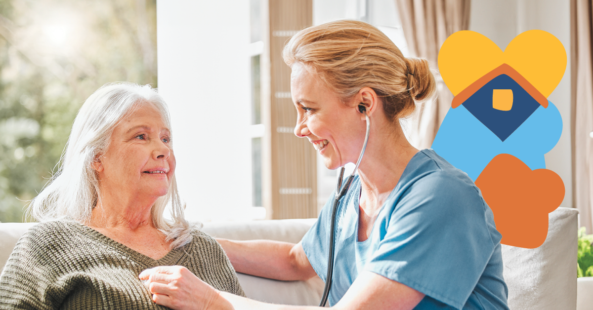 Nurse in blue scrubs listens to an elderly woman's heartbeat with a stethoscope, both smiling, with a colorful heart and house graphic in the background.