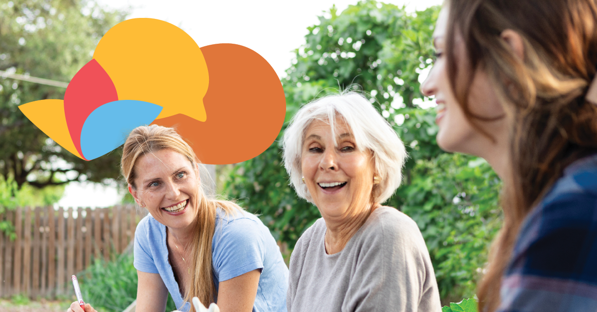 Three women smiling and talking outdoors, with colorful speech bubbles above them, suggesting lively conversation.