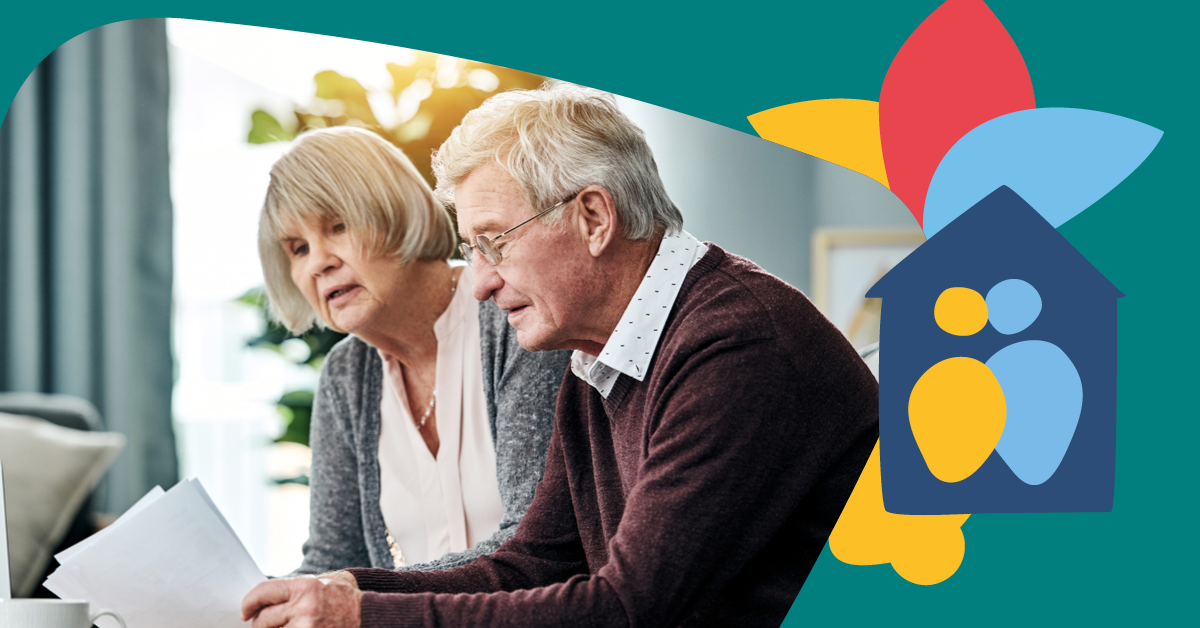 Elderly couple reviewing documents at home, with a colorful house and family icon on the right.