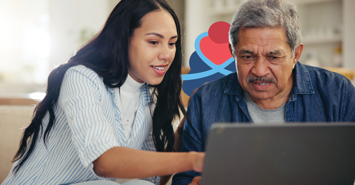 Woman helping an older man use a laptop, both focused on the screen. A colorful abstract logo is in the background.