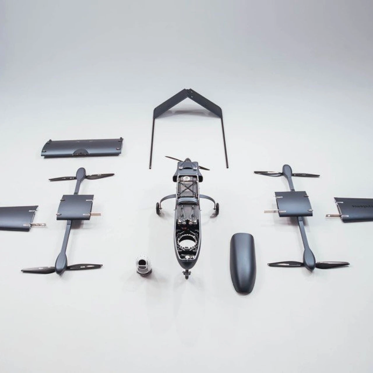 Composite drone components laid out before assembly
