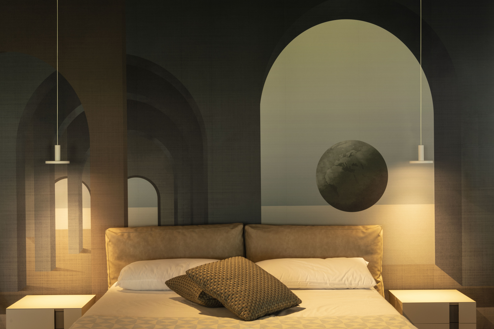 Modern bedroom with geometric wallpaper, two pendant lights, a double bed with beige headboard, and two patterned pillows.