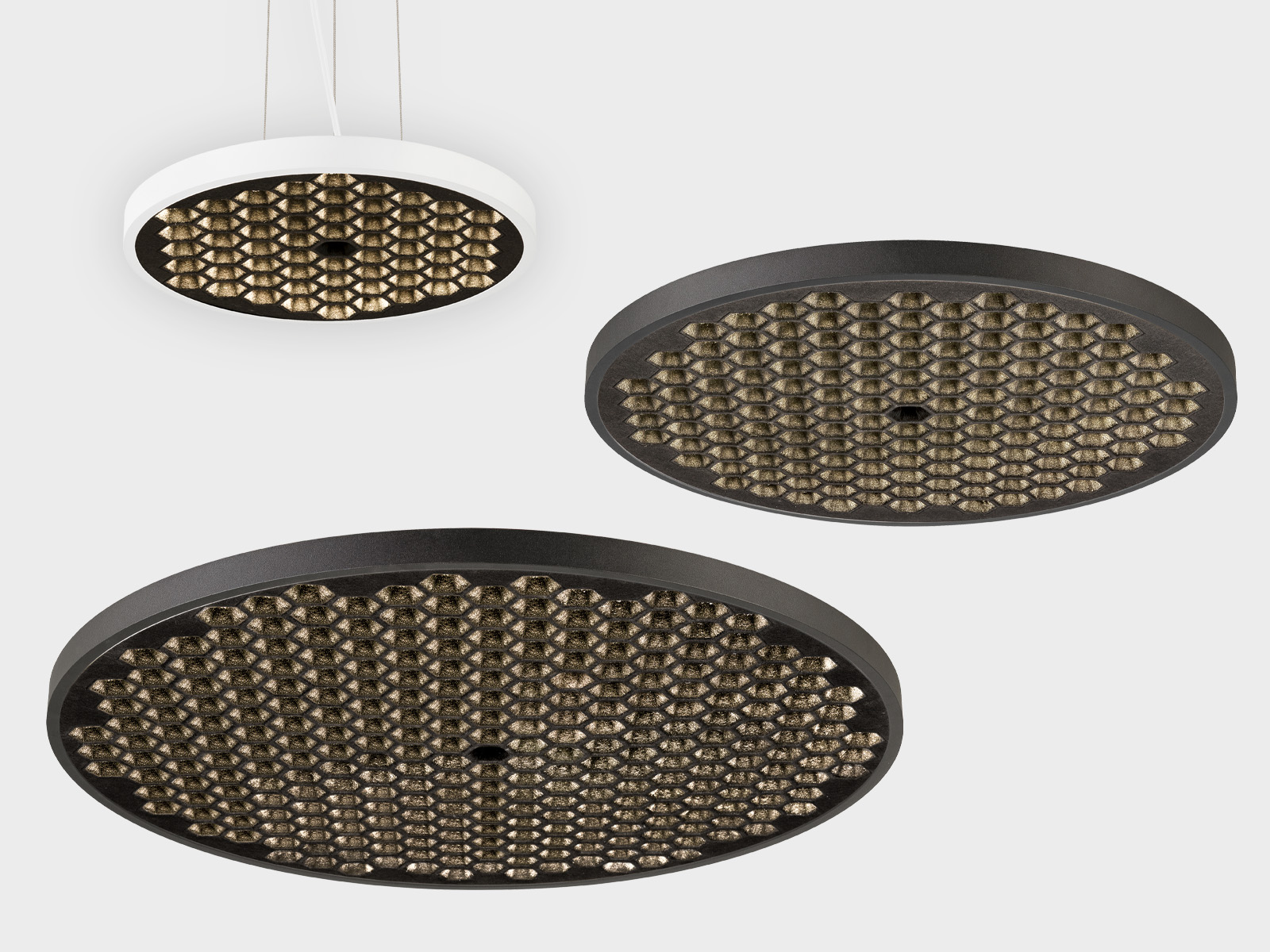 Lámparas colgantes y de techo MEDO® HYVE de SLV con un característico patrón de luz en forma de panal
