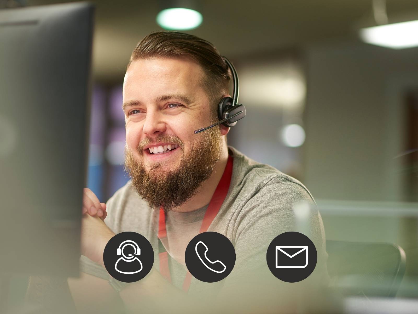Smiling man with a headset working at a computer. Icons of customer support, phone, and email overlay the image.