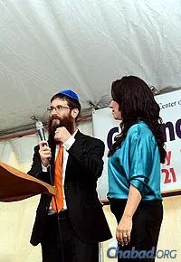 Rabbi Yosef and Chani Konikov addressed the audience at last month’s groundbreaking event.