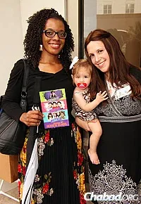 Teachers at the Chai Preschool Alexis Lewis, left, and Dini Druk, with her baby daughter