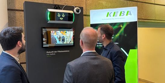 Visitors at the SVN Security Days 2026 discussing the AI-powered surveillance system KeBob at the KEBA stand.