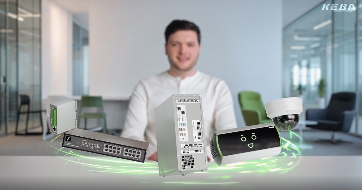 Smiling man in an office, with holographic technology devices floating in front, including a server, router, camera, and smart device KeBob..