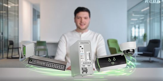 Smiling man in an office, with holographic technology devices floating in front, including a server, router, camera, and smart device KeBob..