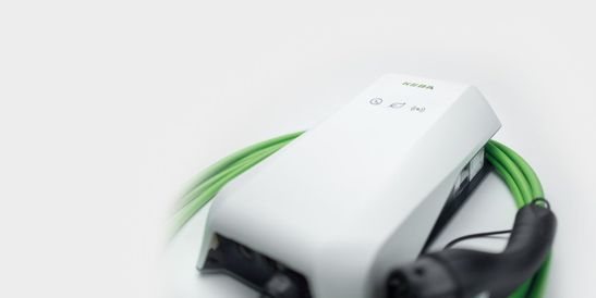 Close-up of the KEBA KeContact P40 wallbox with green charging cable.
