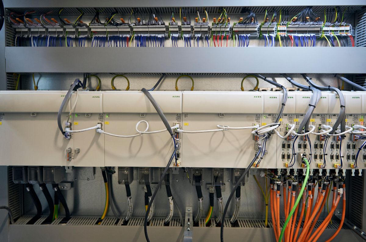 Control cabinet with multiple control and drive units as well as structured wiring inside an SPL production system. The integrated automation components ensure precise machine control, power distribution, and reliable industrial processes 