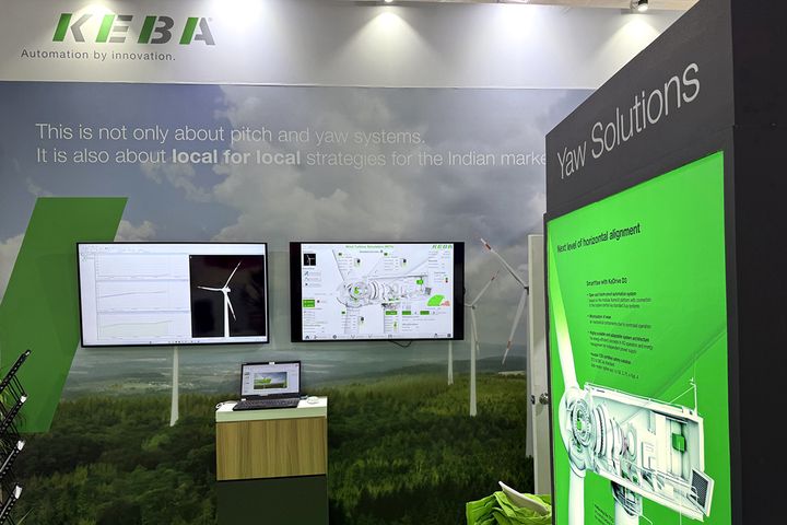 KEBA Booth with Screens, green walls and Slogan "This is not about pitch and yaw system, it is also about local for local strategies for the Indian market."