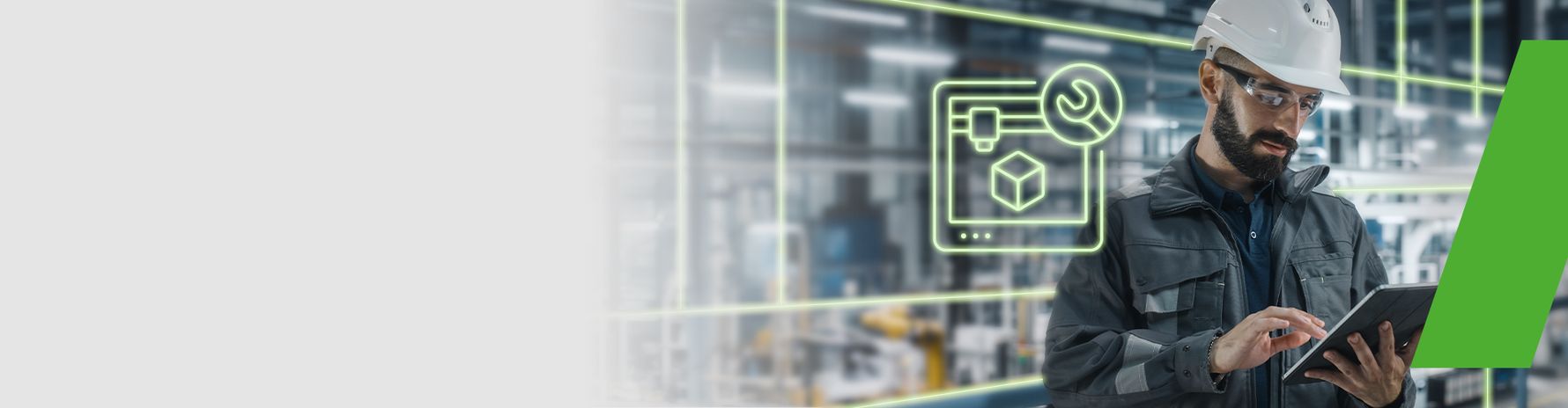 Engineer wearing a safety helmet working on a tablet; symbol of digital maintenance and production monitoring in the background.