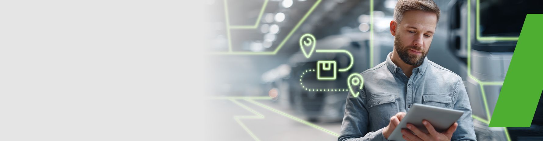 Man working with a tablet; symbol of digital route planning and delivery tracking in the background.