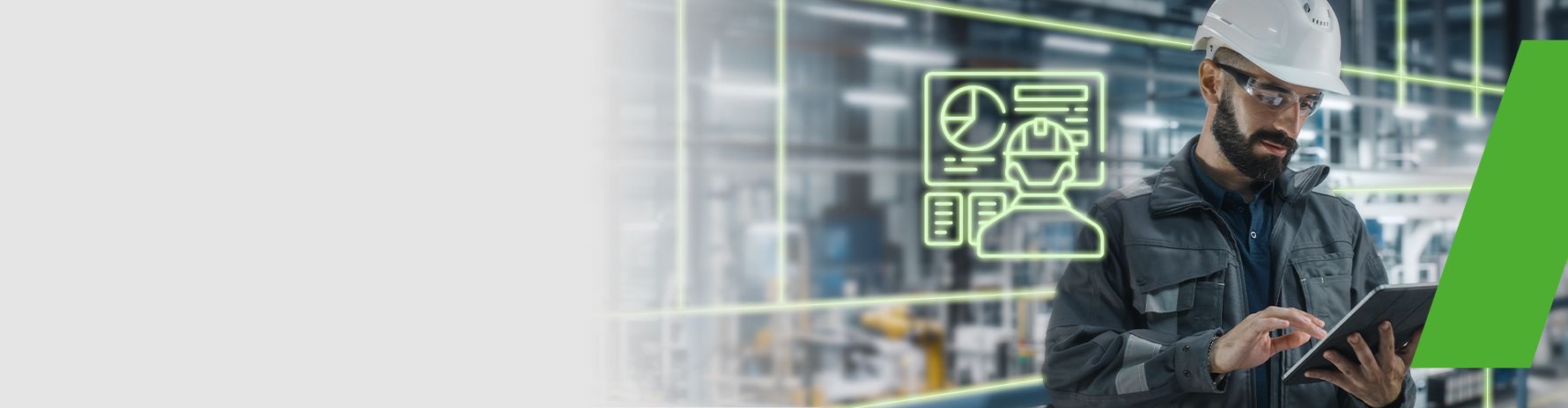 Engineer wearing a safety helmet working on a tablet; symbol of digital data analysis and production planning in the background.