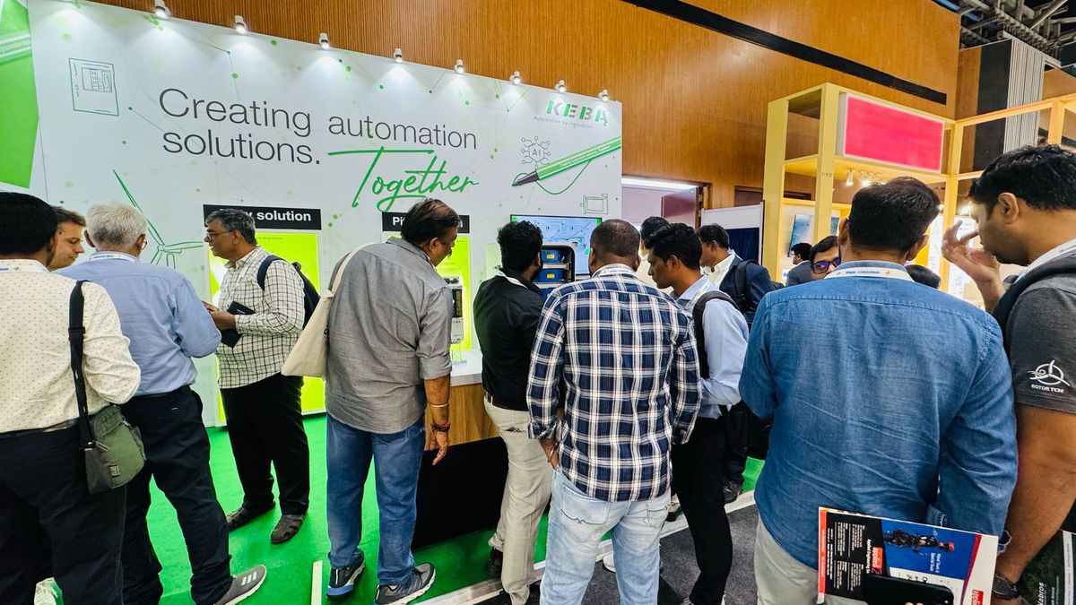 Suzlon and KEBA representatives interacting at the KEBA trade fair booth. 