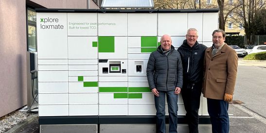 Albert Kastner, Claus Peham, and Michael Mayer are standing in front of the loxmate.