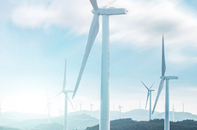 Wind turbines with sky and hills in the background