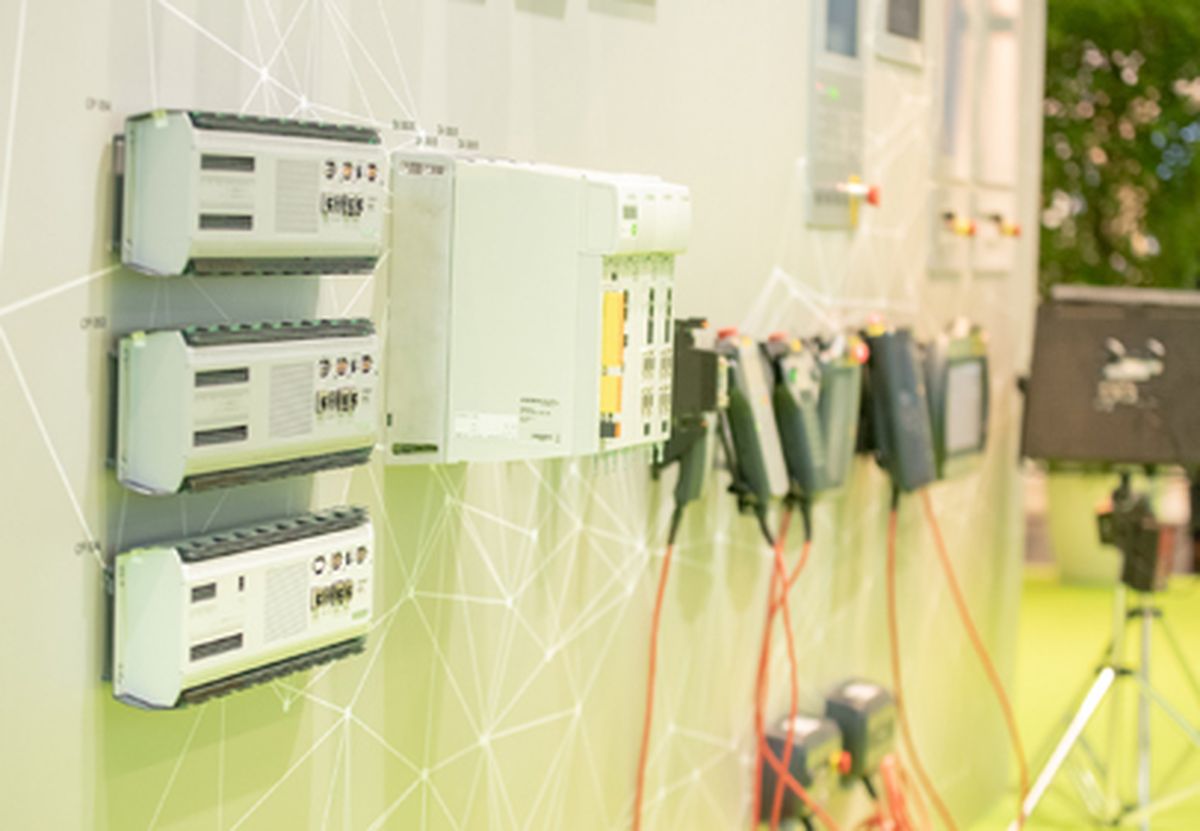 Industrial control units and HMI devices mounted on a presentation wall, showing different variants for machine operation and automation.
