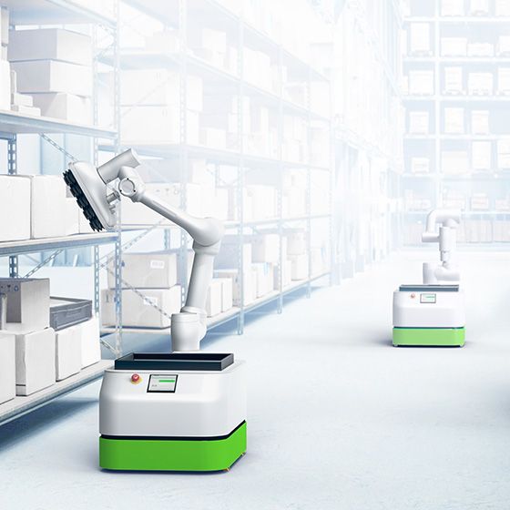 autonomous mobile robots with grippers in a modern warehouse