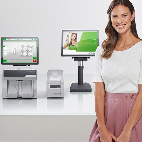Woman standing in front of KeWin Lotto Terminals
