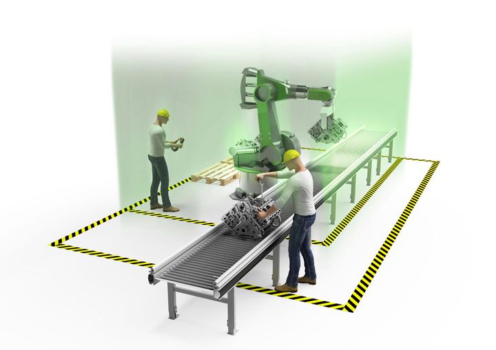 Rendering smart factory: Humans and robots work side by side on the assembly line without safety fences.