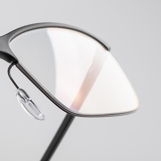half-rim glasses with focus on the lens