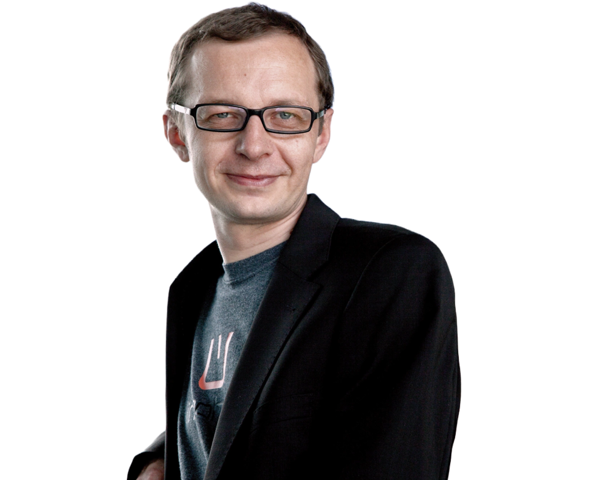 Portrait of Markus Merzinger, Senior Developer and Co-Founder of LingoHub, wearing glasses and a dark blazer over a t-shirt, smiling against a transparent background.